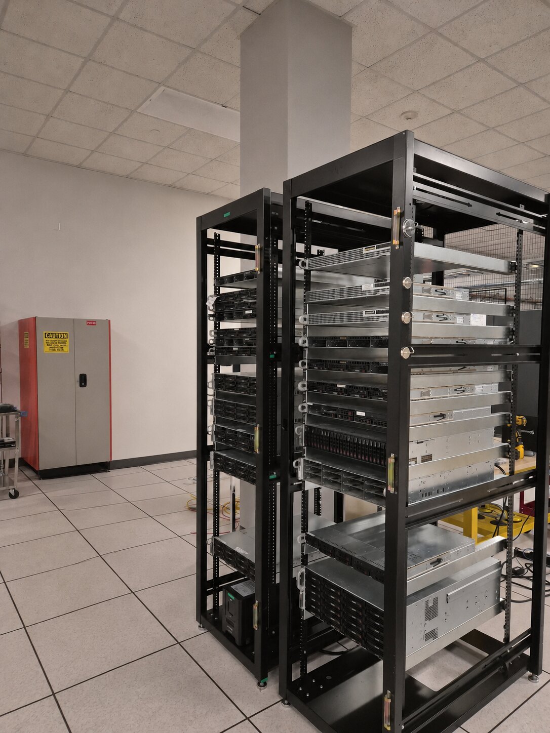 Two racks filled with many different servers supported by American Rails